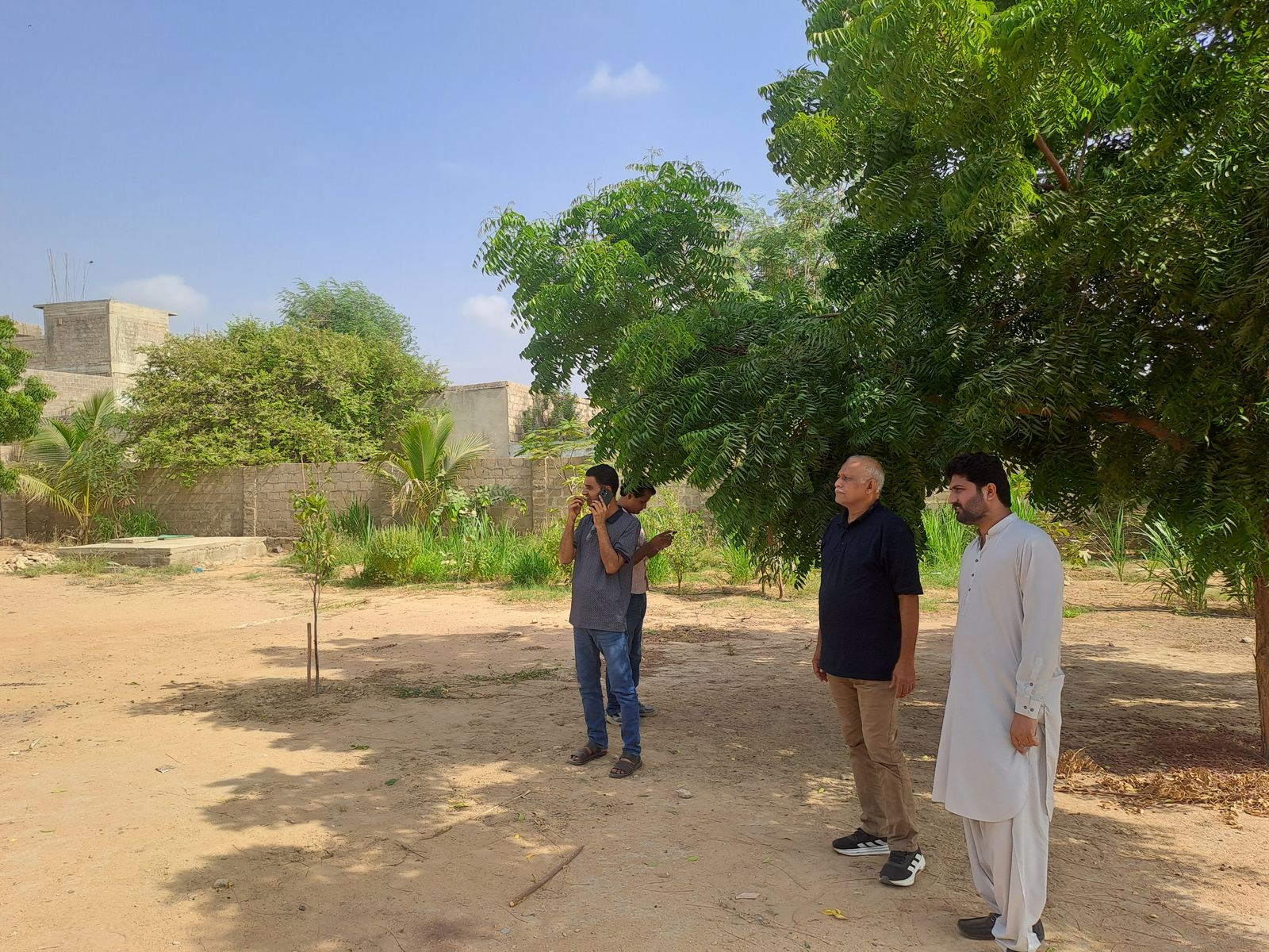 IFZK team reviewing site planning for Biofloc project